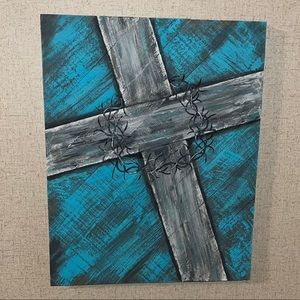 Painted wooden cross with thorns.